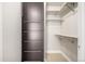Spacious walk-in closet with built-in shelving and hanging racks, providing ample storage space at 2650 Front View # 205, Denver, CO 80211