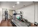 Community gym with modern exercise equipment including a treadmill, elliptical, and weight machine at 2650 Front View # 205, Denver, CO 80211