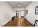 Home gym boasts wood flooring, large mirrors, and fitness equipment for a complete workout experience at 2650 Front View # 205, Denver, CO 80211
