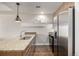 Modern kitchen with stainless steel appliances and granite countertops at 2650 Front View # 205, Denver, CO 80211