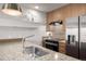 Modern kitchen with stainless steel appliances and granite countertops at 2650 Front View # 205, Denver, CO 80211