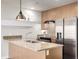 Bright kitchen featuring stainless steel appliances, granite countertops, and modern fixtures at 2650 Front View # 205, Denver, CO 80211