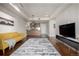 Open-concept living room with hardwood floors seamlessly flowing into the kitchen area at 2650 Front View # 205, Denver, CO 80211