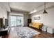 Inviting living room showcasing hardwood floors, neutral decor, and balcony access at 2650 Front View # 205, Denver, CO 80211