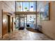 Inviting lobby featuring natural light, modern art, tile flooring, and comfortable seating at 2650 Front View # 205, Denver, CO 80211