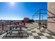 Expansive rooftop deck featuring picnic tables and lounge seating with city views at 2650 Front View # 205, Denver, CO 80211