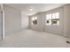 A brightly lit bedroom with large windows, allowing natural light to flood the room, creating a warm and welcoming space at 2877 E 103Rd Dr, Thornton, CO 80229