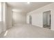 Spacious bedroom with neutral walls, carpet, ensuite bathroom, and a walk-in closet, providing ample storage at 2877 E 103Rd Dr, Thornton, CO 80229