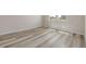 Bedroom with plank flooring has two windows to allow for ample natural light at 2877 E 103Rd Dr, Thornton, CO 80229
