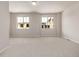 Spacious, brightly lit bedroom with large windows, with a neutral palette offering a blank canvas for personalization at 2877 E 103Rd Dr, Thornton, CO 80229