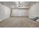 Spacious two-car garage with painted walls and concrete floor at 2877 E 103Rd Dr, Thornton, CO 80229