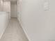 Well-lit hallway with neutral walls and plush carpeting at 2877 E 103Rd Dr, Thornton, CO 80229