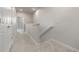 Upstairs hallway features neutral walls, plush carpeting, and a view to the downstairs at 2877 E 103Rd Dr, Thornton, CO 80229