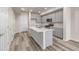 Bright kitchen with stainless steel appliances, ample gray cabinetry, and a large center island at 2877 E 103Rd Dr, Thornton, CO 80229