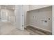 Laundry room with wood-look floors and utility connections at 2877 E 103Rd Dr, Thornton, CO 80229