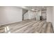 Living space that overlooks a modern kitchen, stairs, and closet at 2877 E 103Rd Dr, Thornton, CO 80229