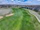 Scenic view of the golf course and neighborhood homes, showcasing the community's beauty at 15046 Verbena St, Thornton, CO 80602