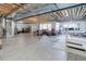 Large unfinished basement with exposed ceiling beams and plenty of storage space for your personal belongings at 15046 Verbena St, Thornton, CO 80602