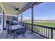 Relaxing covered deck with comfortable seating and stunning views of the adjacent golf course at 15046 Verbena St, Thornton, CO 80602
