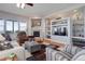 Comfortable living room boasts a fireplace and hardwood flooring at 15046 Verbena St, Thornton, CO 80602