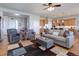 Bright living room features hardwood floors and an open layout at 15046 Verbena St, Thornton, CO 80602