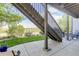 A concrete patio extends under the home's deck, offering additional outdoor space and views of lush landscaping at 15046 Verbena St, Thornton, CO 80602