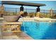 Beautiful community pool with stone accents and water feature, perfect for relaxing and enjoying the outdoors at 15046 Verbena St, Thornton, CO 80602