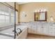 Bathroom with soaking tub and granite vanity at 3967 Eastout Ave, Parker, CO 80138