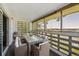 Enclosed condo balcony offers an outdoor dining space with pleasant views at 725 S Alton Way # 7D, Denver, CO 80247