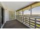 Enclosed balcony offers privacy, brick accents, and views of a treelined park at 725 S Alton Way # 7D, Denver, CO 80247
