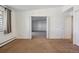 Bedroom with neutral paint, carpet, and a large window with a view at 725 S Alton Way # 7D, Denver, CO 80247