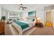 Bright bedroom featuring a ceiling fan, large window, and neatly made bed at 725 S Alton Way # 7D, Denver, CO 80247