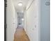 Hallway with neutral carpeting and access to rooms at 725 S Alton Way # 7D, Denver, CO 80247