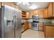 Updated kitchen with stainless steel appliances, tile backsplash, and ample storage space at 725 S Alton Way # 7D, Denver, CO 80247