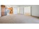 Open-concept living area with a partial view of the kitchen and dining area at 725 S Alton Way # 7D, Denver, CO 80247
