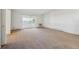 Living room featuring sliding glass doors leading to a balcony at 725 S Alton Way # 7D, Denver, CO 80247