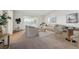 Bright living room featuring modern furniture, neutral tones, and access to a private balcony at 725 S Alton Way # 7D, Denver, CO 80247