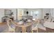 Inviting condo living space with open floor plan, featuring dining area and comfortable seating at 725 S Alton Way # 7D, Denver, CO 80247