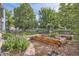 Lush backyard with raised garden beds, offering a serene and green outdoor space at 209 S Lincoln St, Denver, CO 80209