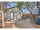Backyard featuring a patio, a lush tree, and an outbuilding at 209 S Lincoln St, Denver, CO 80209