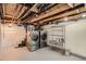 Basement with washer, dryer, and storage shelving at 209 S Lincoln St, Denver, CO 80209
