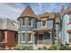 Charming home featuring a turret, brick accents, and a well-manicured front yard at 209 S Lincoln St, Denver, CO 80209