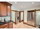 Bright kitchen featuring stainless steel refrigerator, hardwood floors and beautiful wood trim at 209 S Lincoln St, Denver, CO 80209