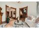 Bright and airy living room with hardwood floors, ornate trim, and a view to the foyer at 209 S Lincoln St, Denver, CO 80209