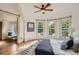 The main bedroom featuring large bright windows with views and a neutral color palette at 209 S Lincoln St, Denver, CO 80209