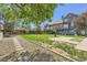 Spacious backyard with lush green grass and a serene patio area at 1300 S Monaco Pkwy # 12, Denver, CO 80224