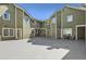 View of a shared courtyard with multiple entrances and a neutral color scheme at 1300 S Monaco Pkwy # 12, Denver, CO 80224