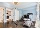 Home gym with light blue walls, including treadmill, rowing machine, and a laundry area at 1300 S Monaco Pkwy # 12, Denver, CO 80224