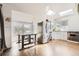 Eat-in kitchen with stainless steel appliances, white cabinets, and skylights at 1300 S Monaco Pkwy # 12, Denver, CO 80224