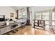 Inviting living room featuring a window seat, hardwood floors, and natural light at 1300 S Monaco Pkwy # 12, Denver, CO 80224